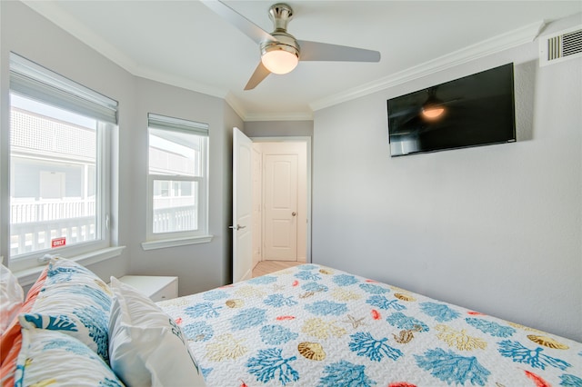 bedroom with ornamental molding and ceiling fan