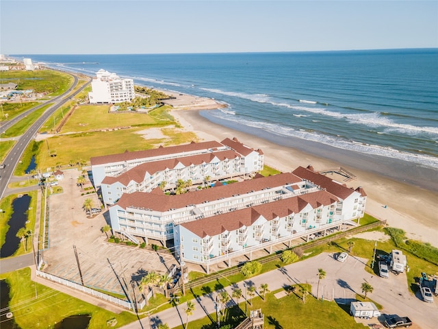 drone / aerial view with a water view and a view of the beach