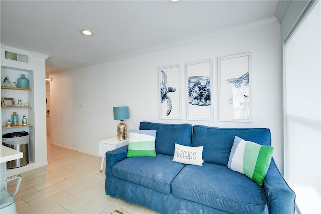 living room with light hardwood / wood-style floors and crown molding