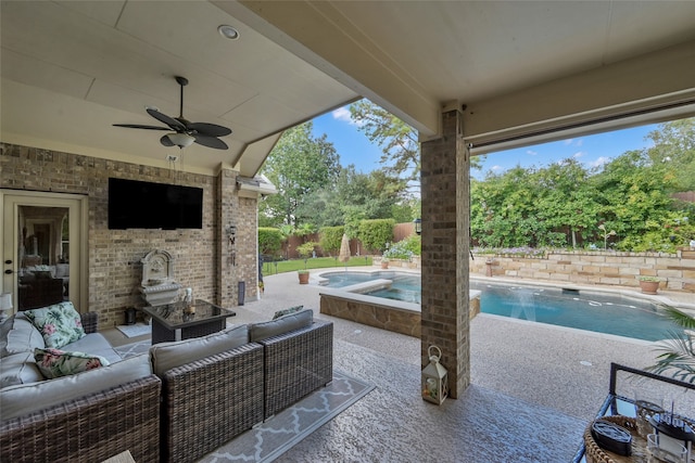 view of patio / terrace featuring an outdoor hangout area, a pool with hot tub, and ceiling fan