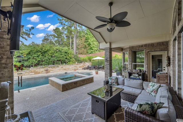 view of patio with ceiling fan, a swimming pool with hot tub, and outdoor lounge area