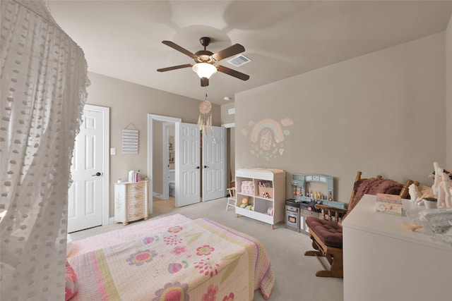 bedroom with ceiling fan and light colored carpet