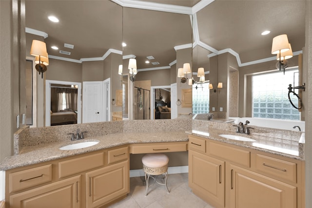 bathroom with vanity, ornamental molding, and tile patterned flooring