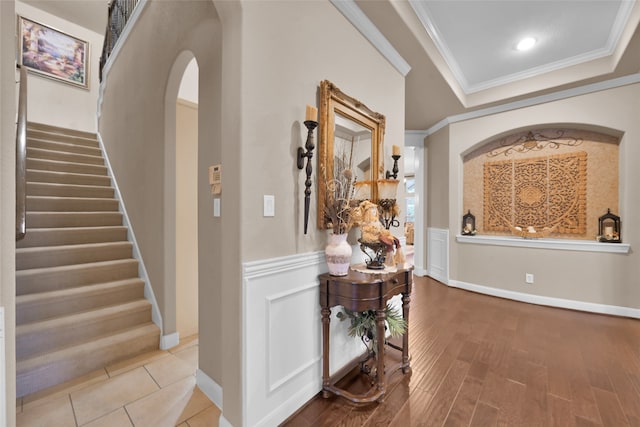 hallway with crown molding and wood-type flooring