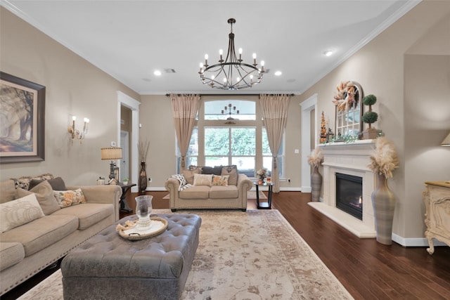 living room with dark wood-type flooring, ornamental molding, and a chandelier