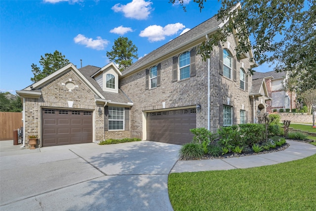 view of front facade featuring a front lawn and a garage