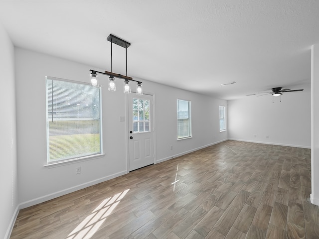 interior space featuring ceiling fan and hardwood / wood-style floors