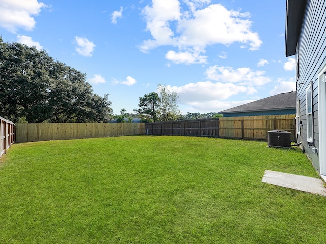 view of yard featuring central AC unit