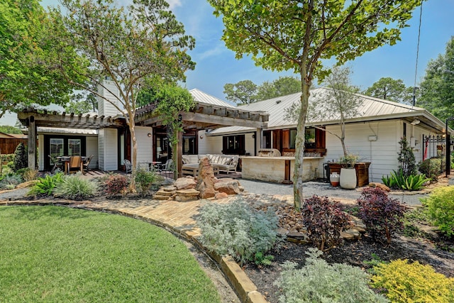 back of house with a patio, a pergola, and a yard