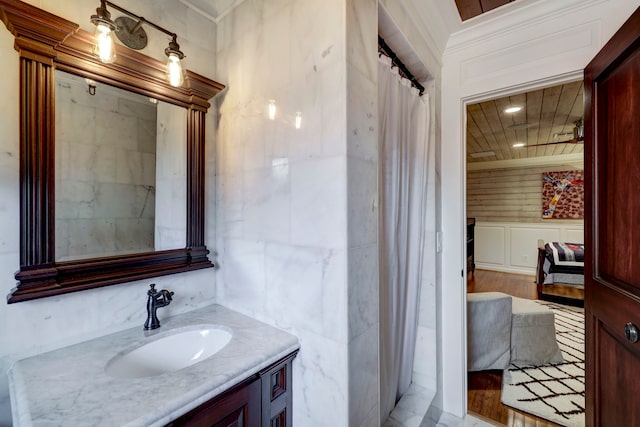 bathroom with vanity, hardwood / wood-style floors, and walk in shower