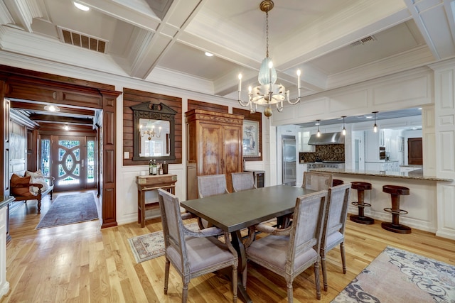 dining room with beamed ceiling, coffered ceiling, light hardwood / wood-style flooring, and crown molding