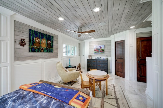 bedroom with wood ceiling and ceiling fan