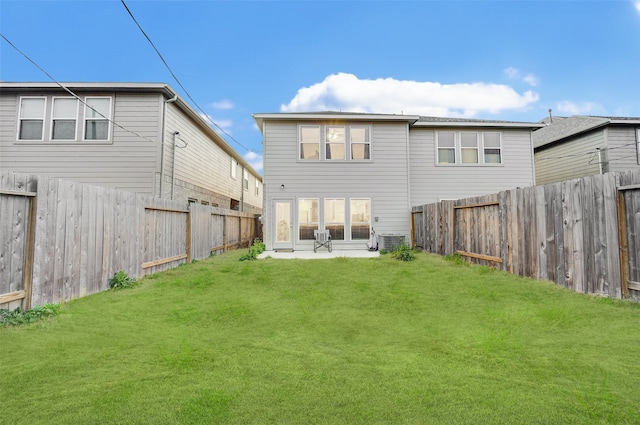 back of house featuring a patio, central AC unit, and a lawn