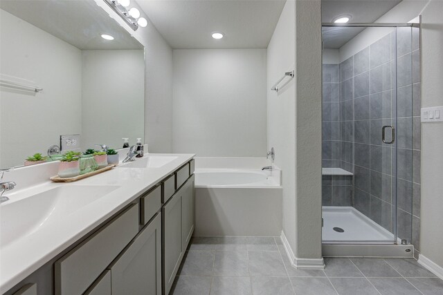 bathroom with vanity, shower with separate bathtub, and tile patterned floors