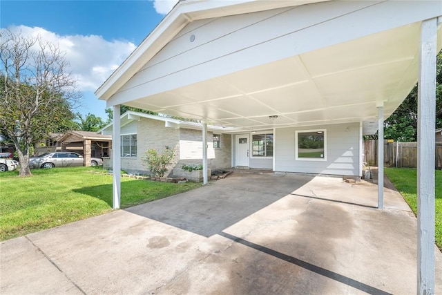 view of front facade with a patio and a front lawn