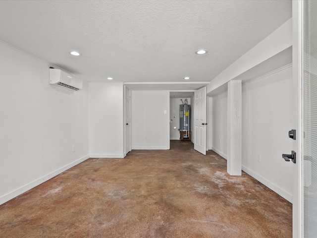 basement featuring an AC wall unit, water heater, and a textured ceiling