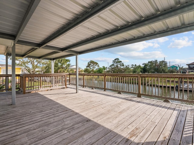 wooden deck featuring a water view