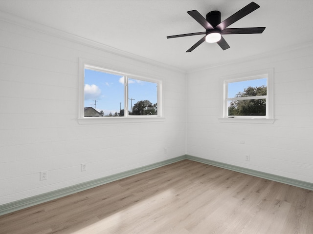 unfurnished room with light hardwood / wood-style flooring, plenty of natural light, and ceiling fan