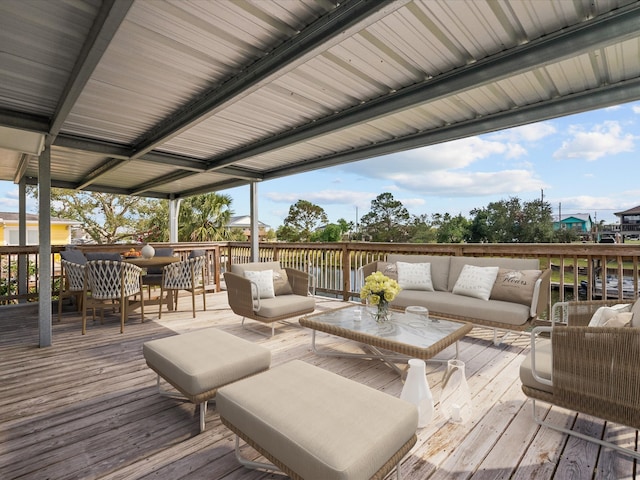 wooden terrace featuring an outdoor living space