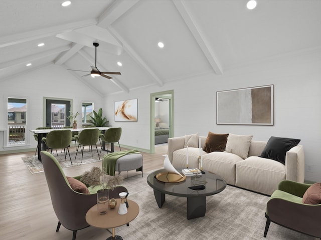 living room with vaulted ceiling with beams, light hardwood / wood-style floors, and ceiling fan