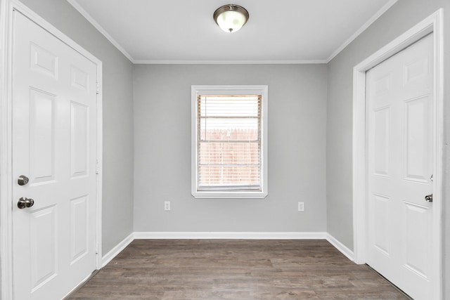 unfurnished bedroom featuring crown molding and dark hardwood / wood-style flooring