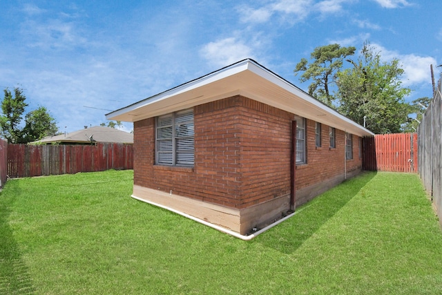 view of side of property with a yard