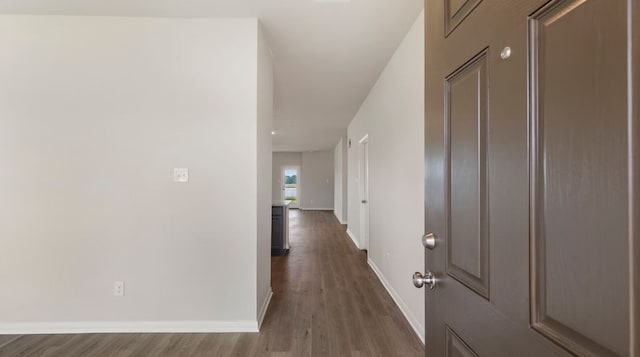 corridor featuring dark wood-type flooring