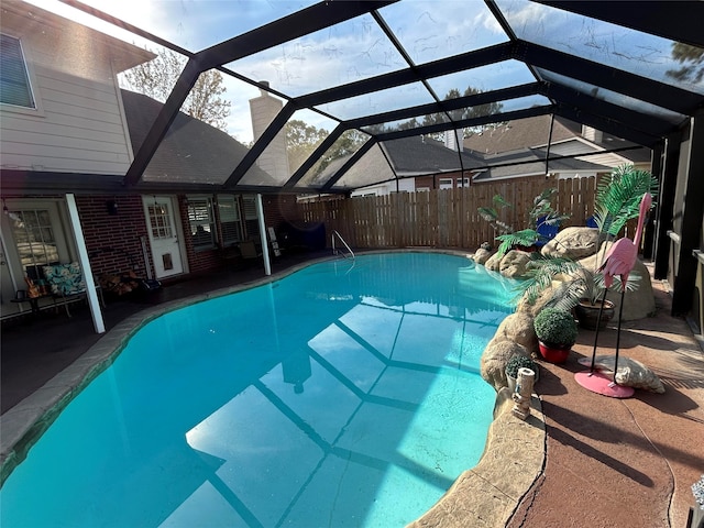 view of pool featuring a patio area and a lanai