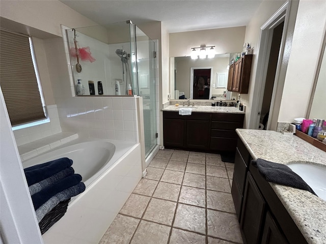 bathroom with vanity and separate shower and tub