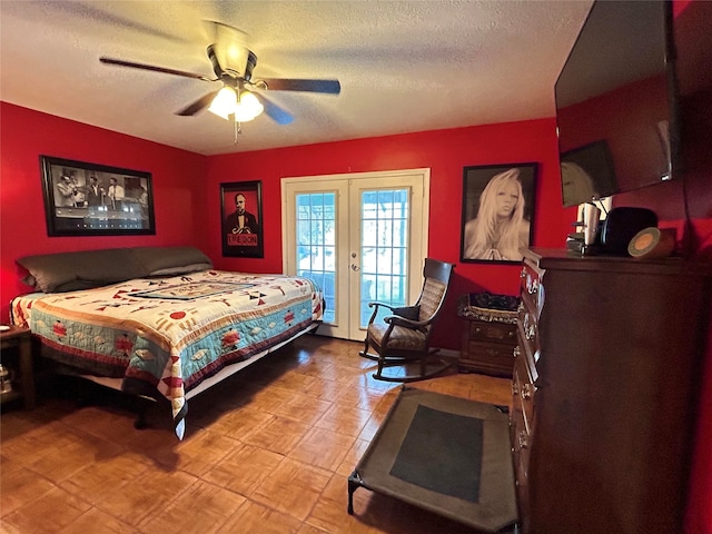 bedroom with french doors, access to exterior, a textured ceiling, and ceiling fan