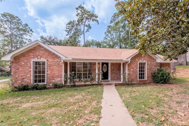 single story home featuring a front yard