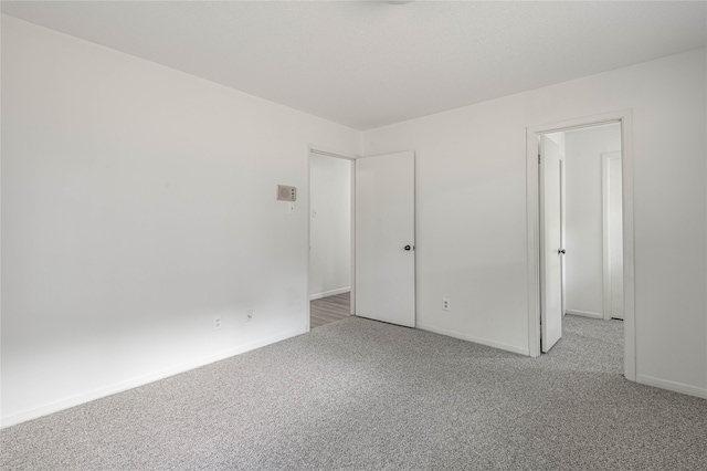 unfurnished bedroom featuring light carpet