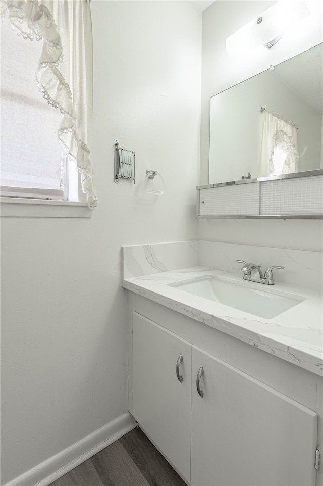 bathroom featuring vanity and hardwood / wood-style floors