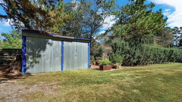 view of outdoor structure with a yard