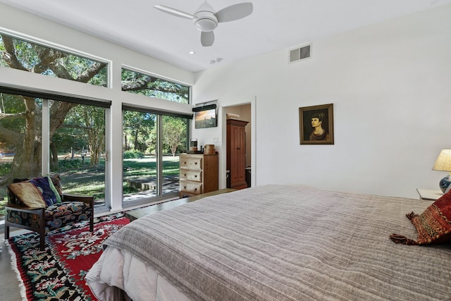 bedroom with multiple windows, access to outside, and ceiling fan