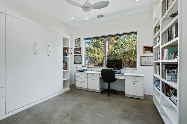 unfurnished office featuring ceiling fan