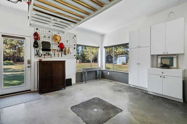 kitchen with white cabinetry and a healthy amount of sunlight