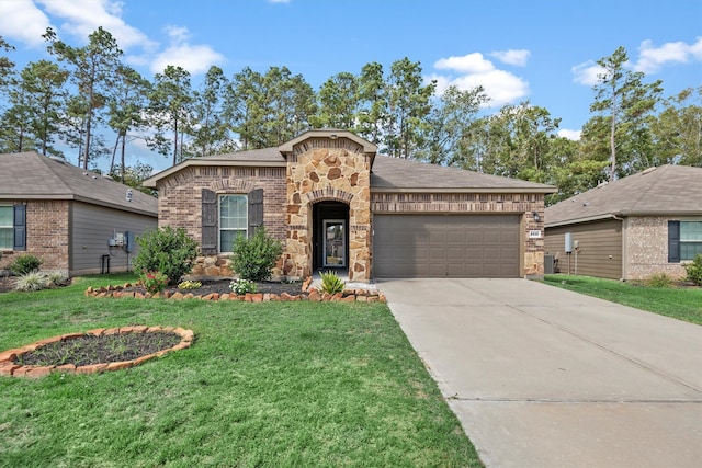 view of front of home featuring a front yard, cooling unit, and a garage