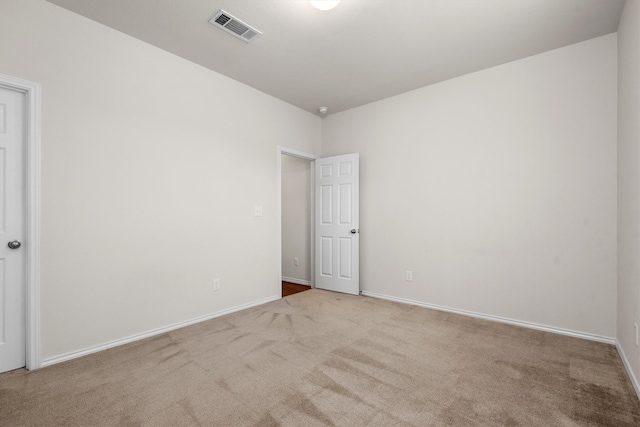 unfurnished room with carpet flooring