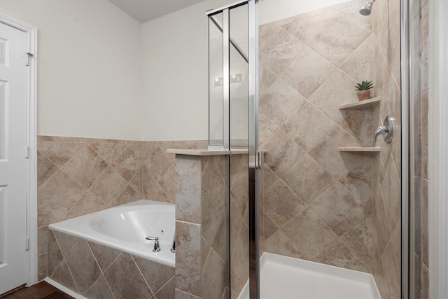 bathroom featuring separate shower and tub