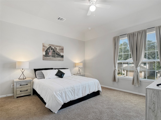 bedroom with light carpet and ceiling fan