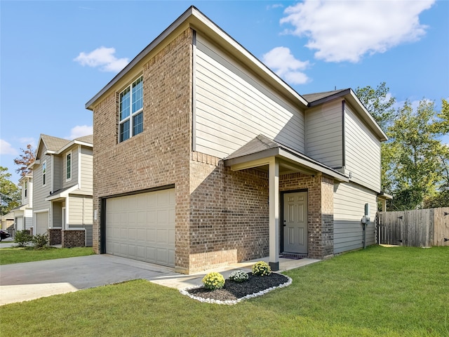 view of front of property featuring a front yard and a garage