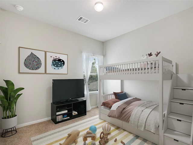 bedroom with light colored carpet