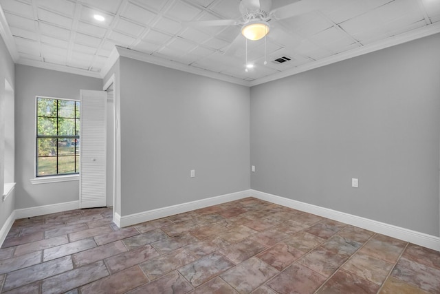 spare room with ornamental molding and ceiling fan