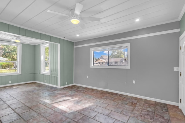 empty room with crown molding and ceiling fan