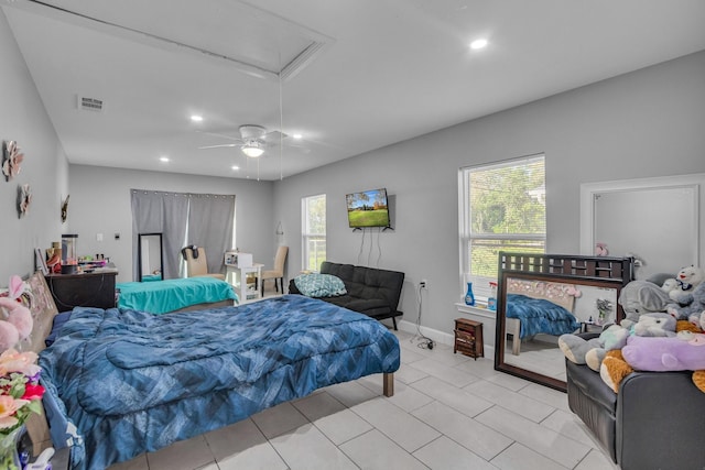 tiled bedroom with ceiling fan