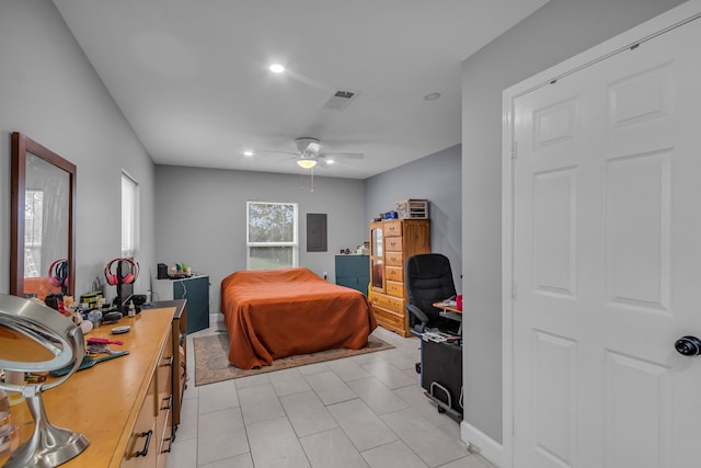 tiled bedroom featuring electric panel and ceiling fan