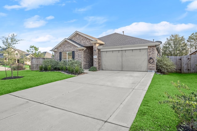 single story home featuring a garage and a front yard