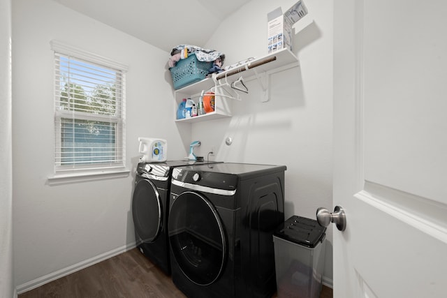 washroom featuring separate washer and dryer and dark hardwood / wood-style flooring