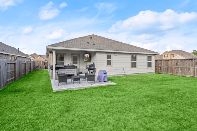 back of property with a lawn and a patio